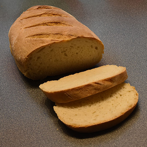 Rustikk loff etter oppskrift fra Baker Brun Ingredienser: 6 dl Vann ½ pk Gjær 1 Egg 2 ts Salt 1 kg Hvetemel 2 ss Olivenolje